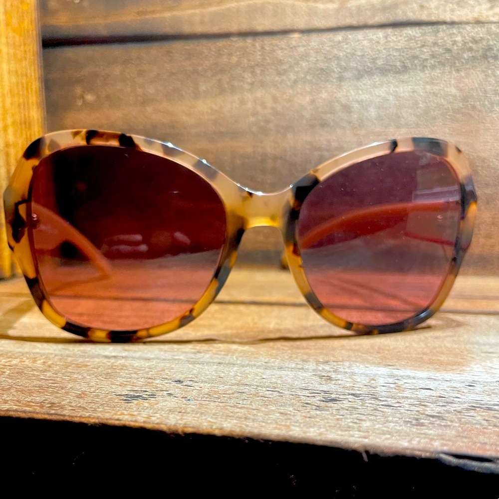 Tory Burch sunglasses, blush temples, tortoise front frame, gold hardware.